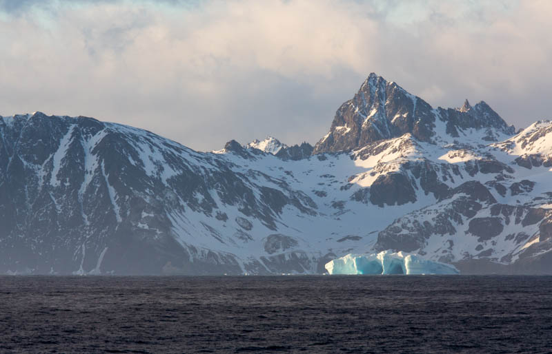 Iceberg And Mountains